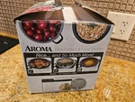 Aroma ARC-743-1NG Simultaneous Rice Cooker, Steamer, One Touch Cooking 6 Cup. Fixed Price $10.00.