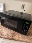 Mainstays EM720CGA-W 0.7 Cu Ft Countertop Microwave Oven. Fixed Price $24.99.