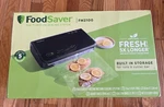 New Foodsaver Fm 2100-000 Vacuum Sealing System With Starter Kit Free Shipping. Fixed Price $89.99.
