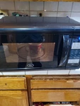 Oster Countertop Microwave Oven 1100W Black Digital Display. Fixed Price $119.99.