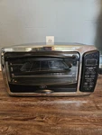 Oster 6057 6-SLICE Digital Convection Toaster Oven Stainless Steel & Black. Fixed Price $35.00.