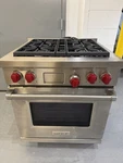 Wolf DF304 - 30" Professional Dual Fuel Range Burners Red Knobs. Fixed Price $4200.00.
